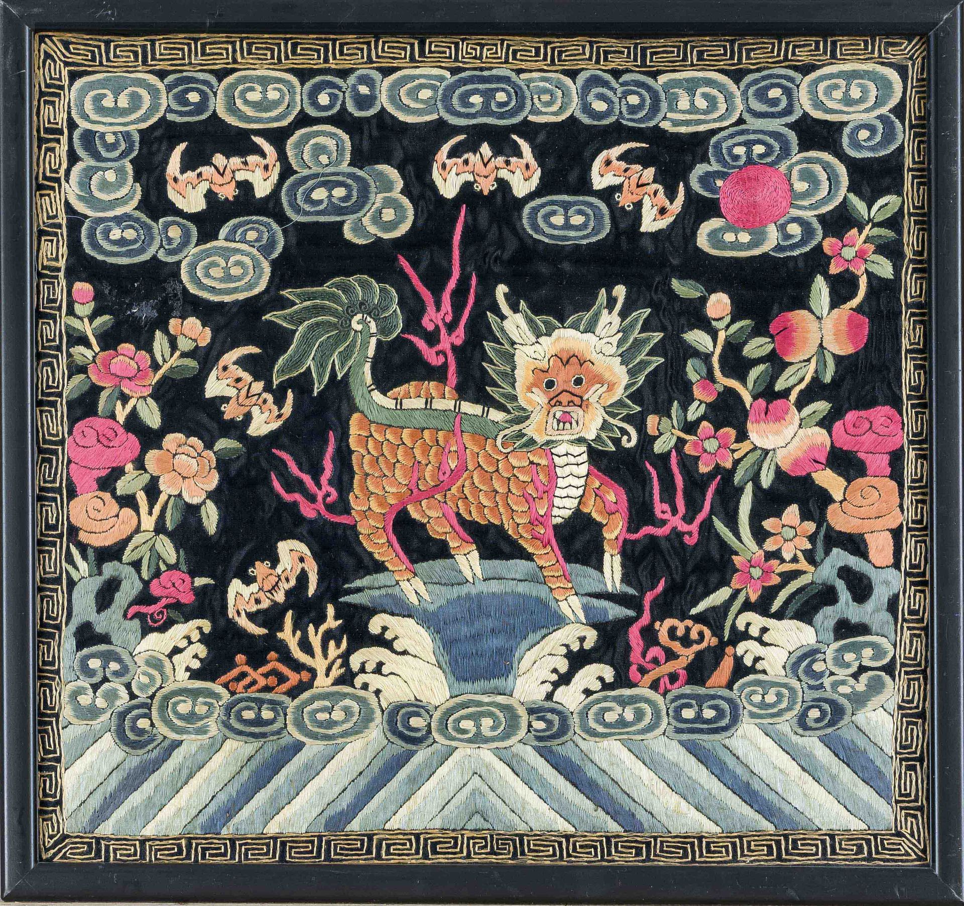 Silk embroidery, China late Qing, Qilin surrounded by stylized bands of clouds, bats and flowers.