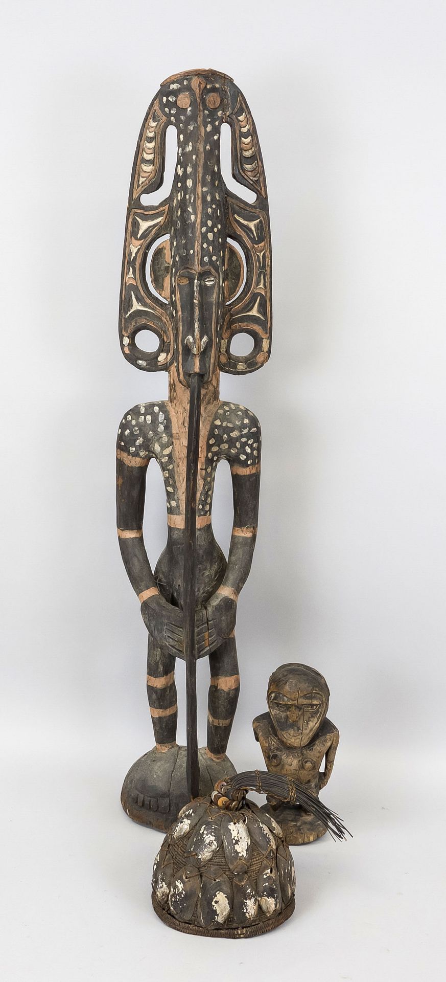 2 ancestor figures, probably West Africa, 19th/20th century, wood, textile/bast, shells, horn