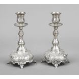 A pair of candlesticks, 20th century, silver tested, round domed stand on 4 feet, baluster shaft,