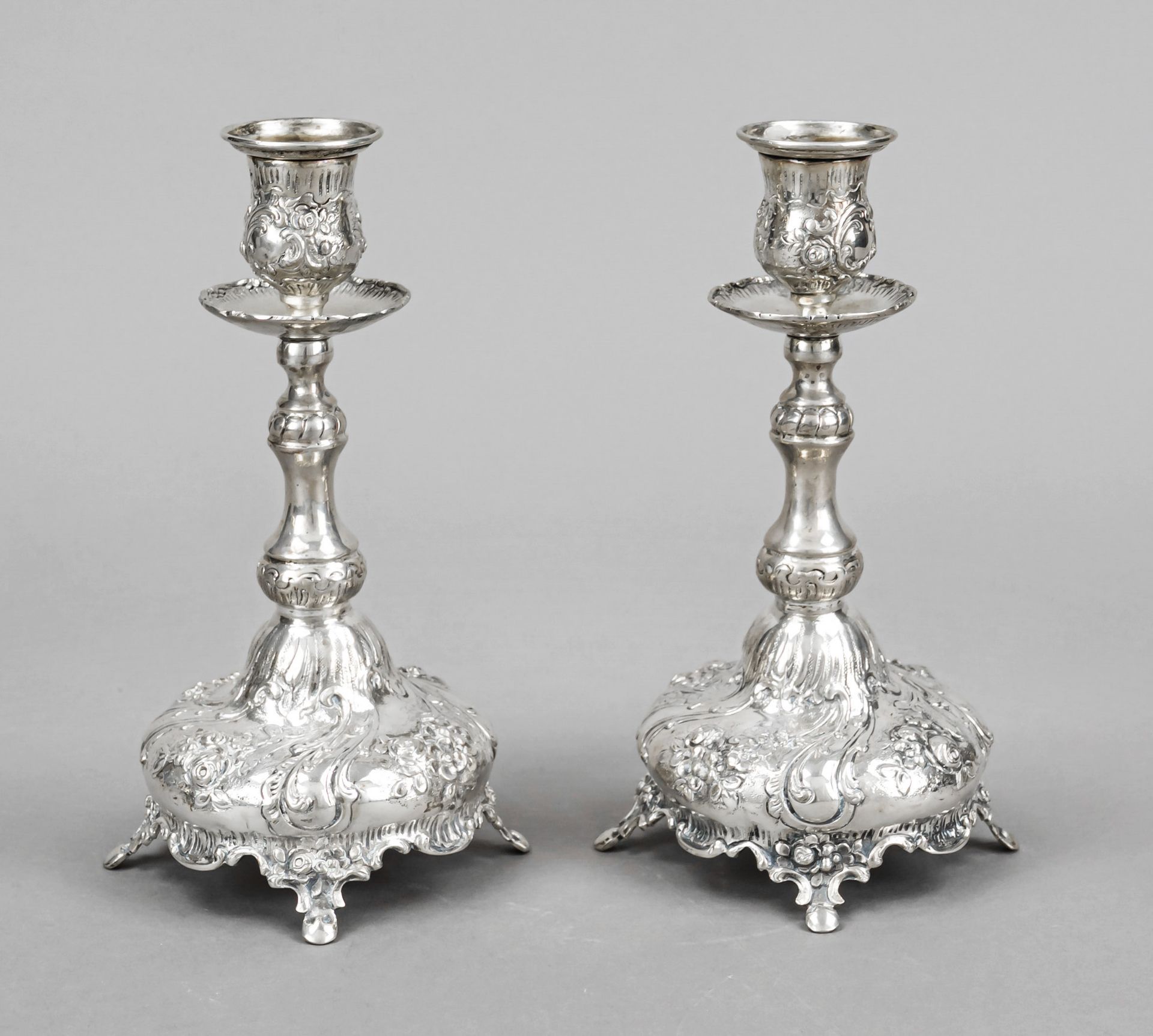 A pair of candlesticks, 20th century, silver tested, round domed stand on 4 feet, baluster shaft,