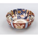 Glazed Imari bowl, Japan, 20th century. Inner and outer walls under and on the glaze in cobalt blue,