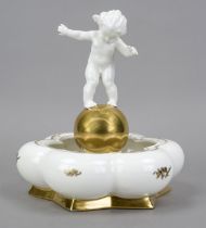 A bowl with a putto, Hutschenreuther, Selb, lion mark, 1955-1968, design by Karl Tutter, signed,