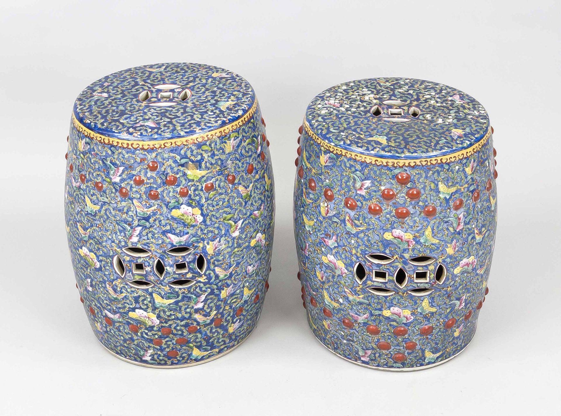 Pair of garden stools, China, probably 1st half 20th century, blue-ground Famille Rose decoration