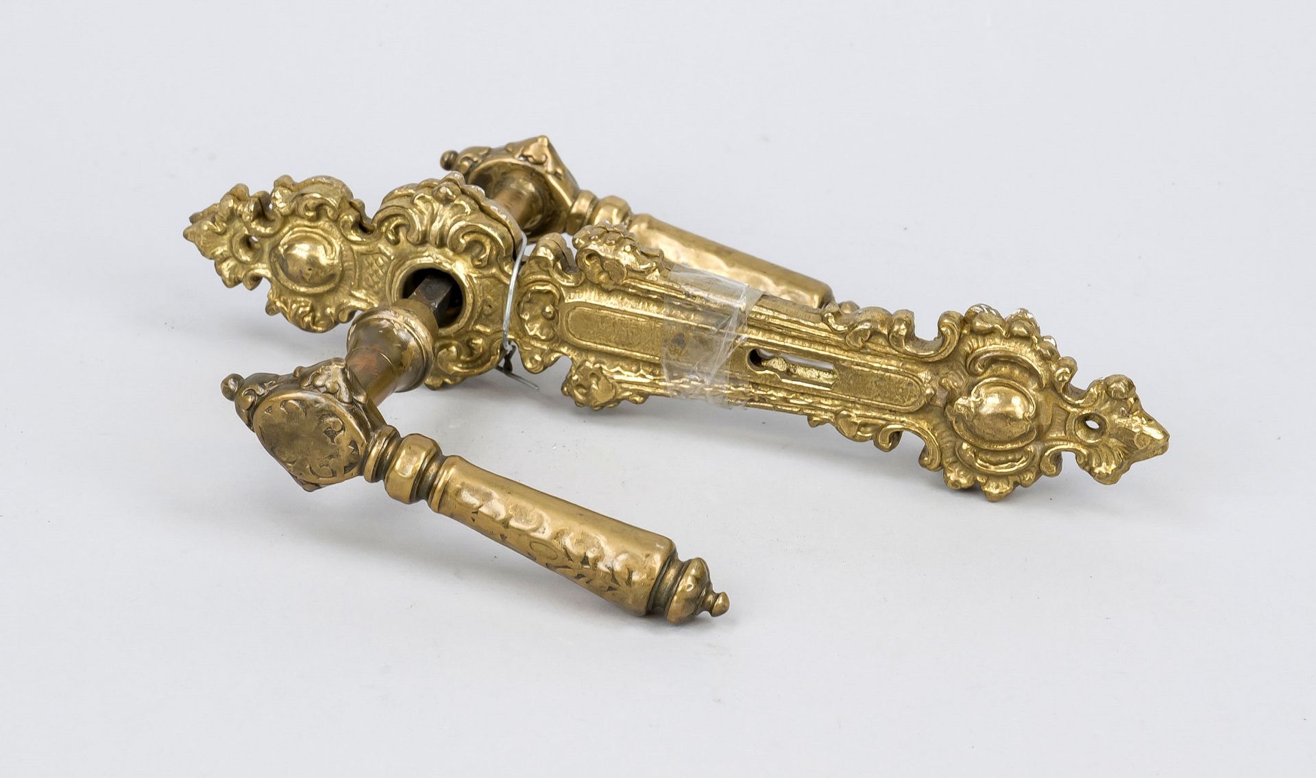 Wilhelminian style lever handle set, 2nd half 19th century, brass. Fitting curved and ornamented