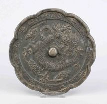 Bronze mirror, China, exact age uncertain. Eight-pass curved, relief decoration with a writhing