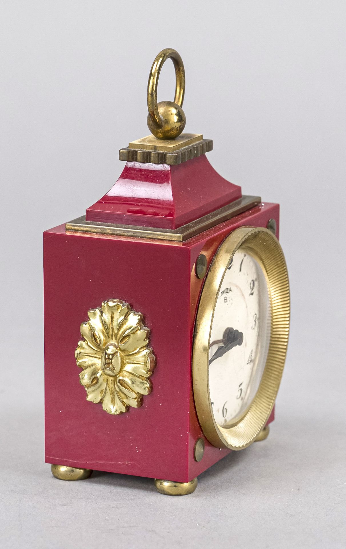 Swiza travel alarm clock, circa 1985, red plastic with gilded decorative elements, top handle, - Image 2 of 2