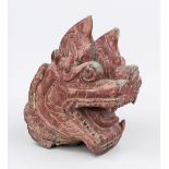 Head of a temple lion, Southeast Asia, 19th century (or earlier?), dark hardwood painted in red,