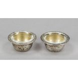 Pair of round saliers, German, 20th century, silver 800/000, gilded interior, smooth form, relief