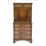 Small standing secretary, England 20th century, mahogany, below four drawers, above straight writing