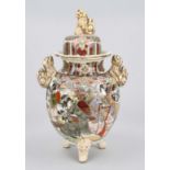 Satsuma lidded vase, Japan c. 1900 (Meiji), bulbous body on 3 feet with figural handles. Lid with