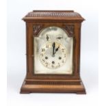 Mahogany table clock, Junghans, 2nd half 19th century, decorated with gallery and carvings such as