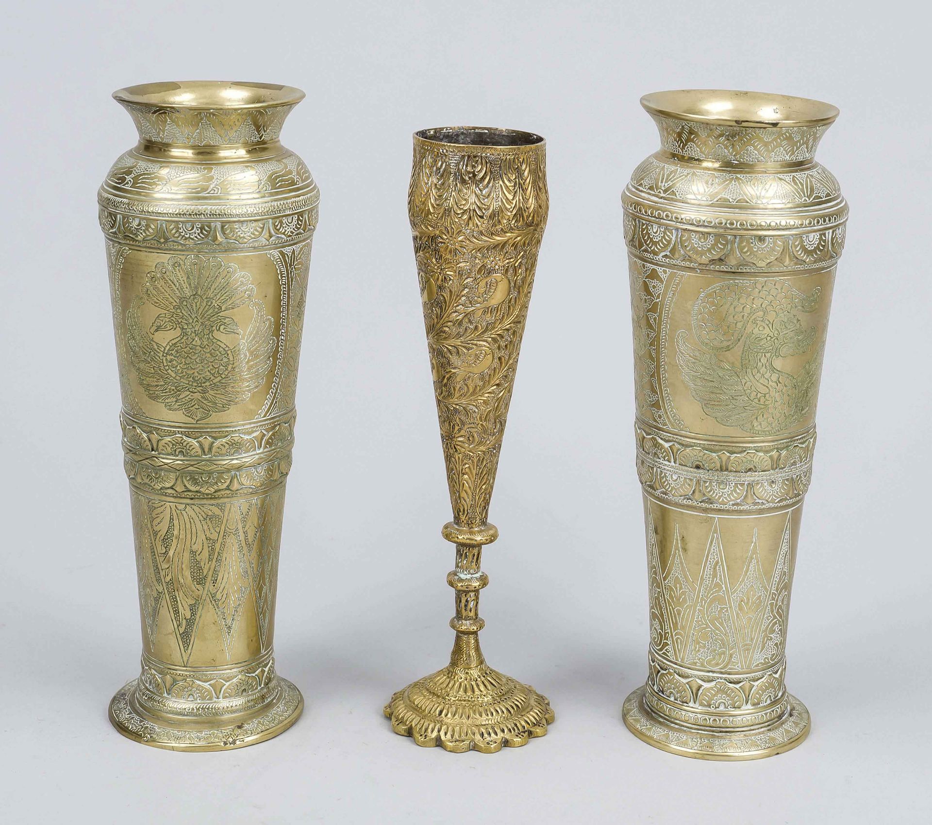 Three brass vases, 19th/20th century, probably Indo-Persian. One pair of vases with fine, engraved