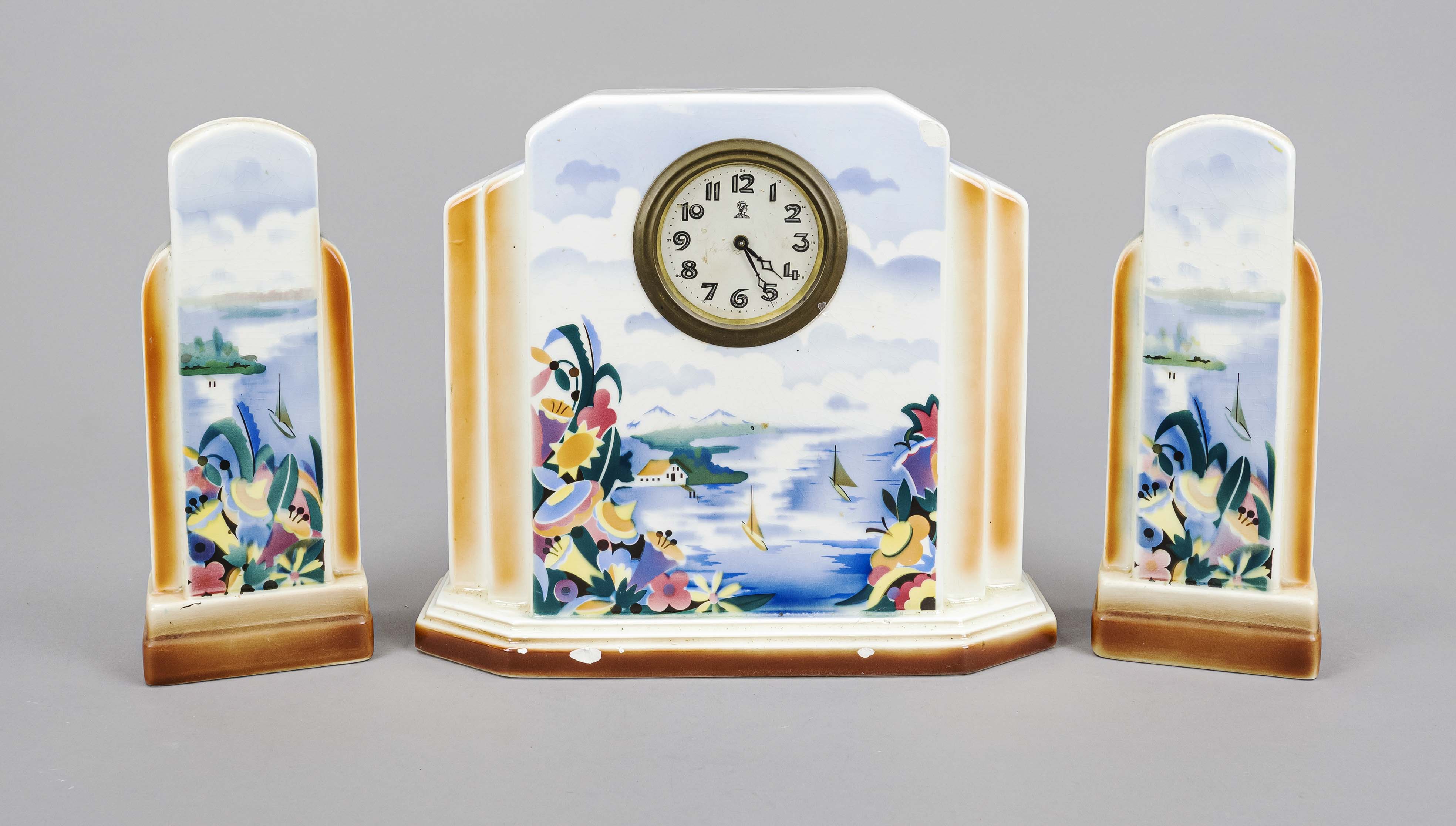 Art Déco porcelain clock set, circa 1920, dial marked ''Minerva'', abstract polychrome landscape,