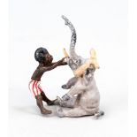 Small bronze in the style of Viennese bronzes, 20th century, Boy as dentist of a baby elephant,