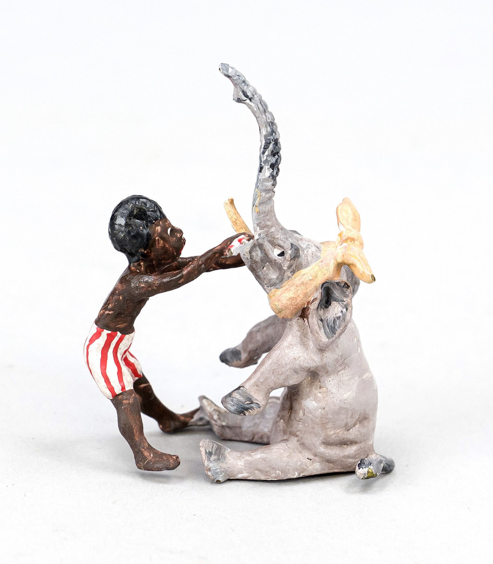 Small bronze in the style of Viennese bronzes, 20th century, Boy as dentist of a baby elephant,