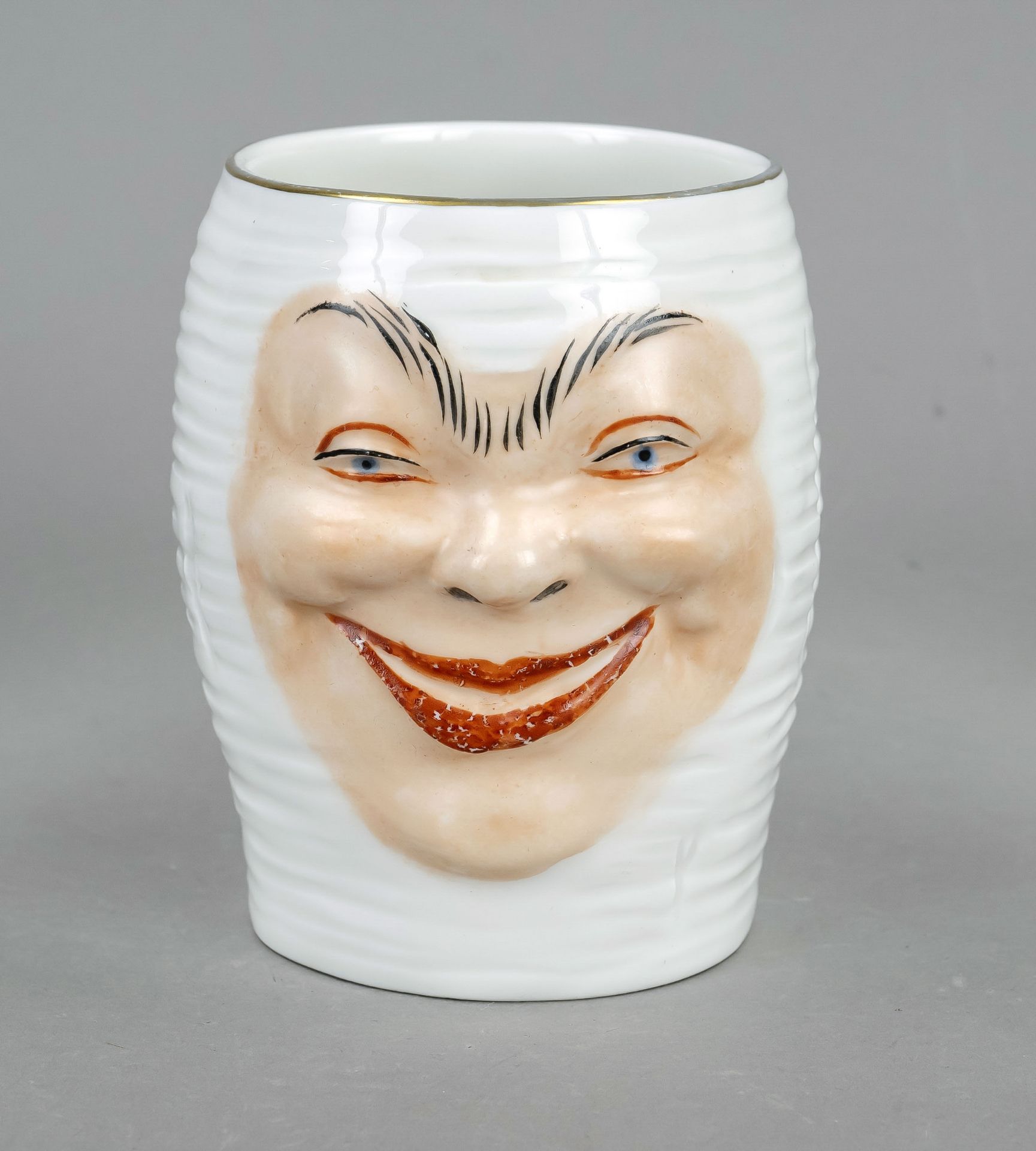 Student's beer mug, Meissen, mark after 1934, 1st choice, joke mug with relief wall, a laughing face