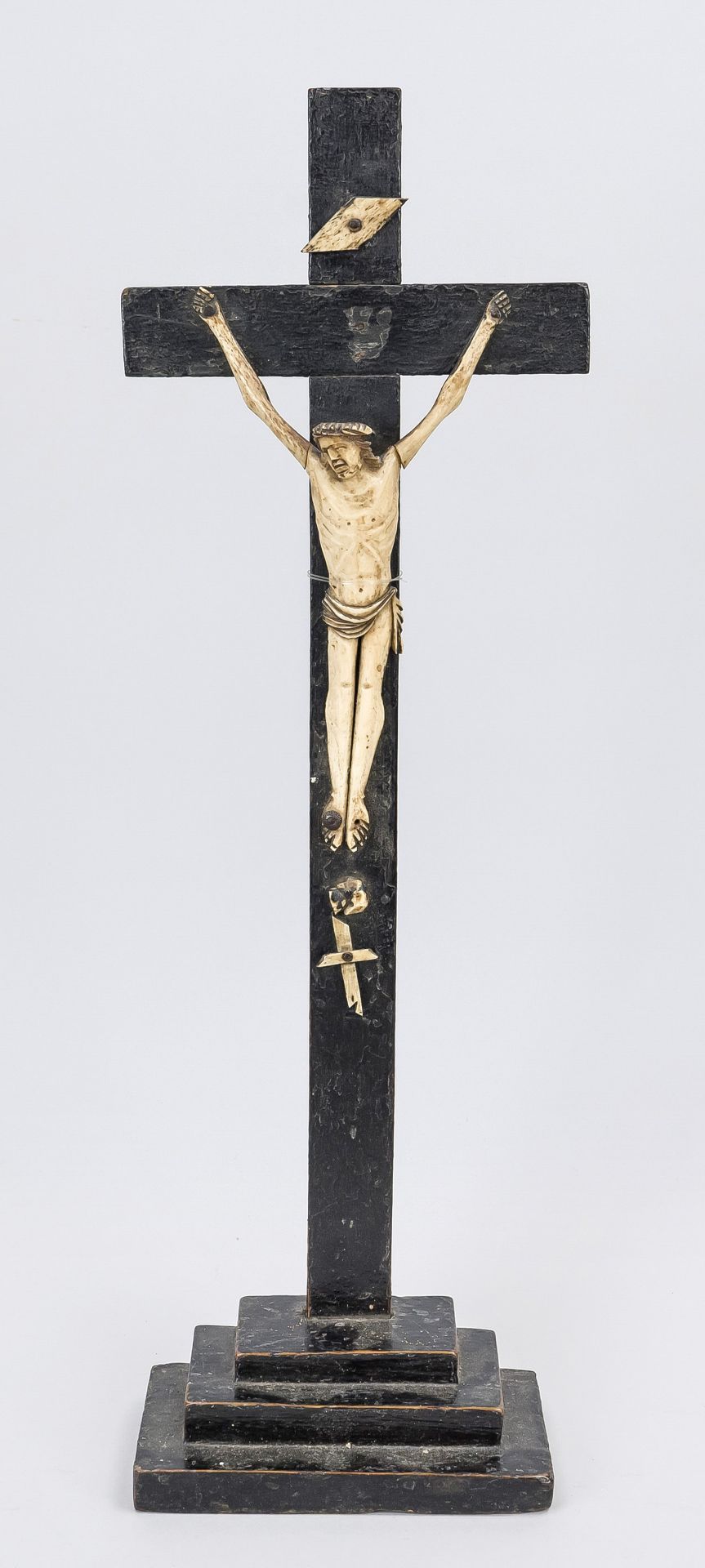 Crucifix, 18th century, wood and bone. Square, stepped pedestal with Christ on the cross, carved