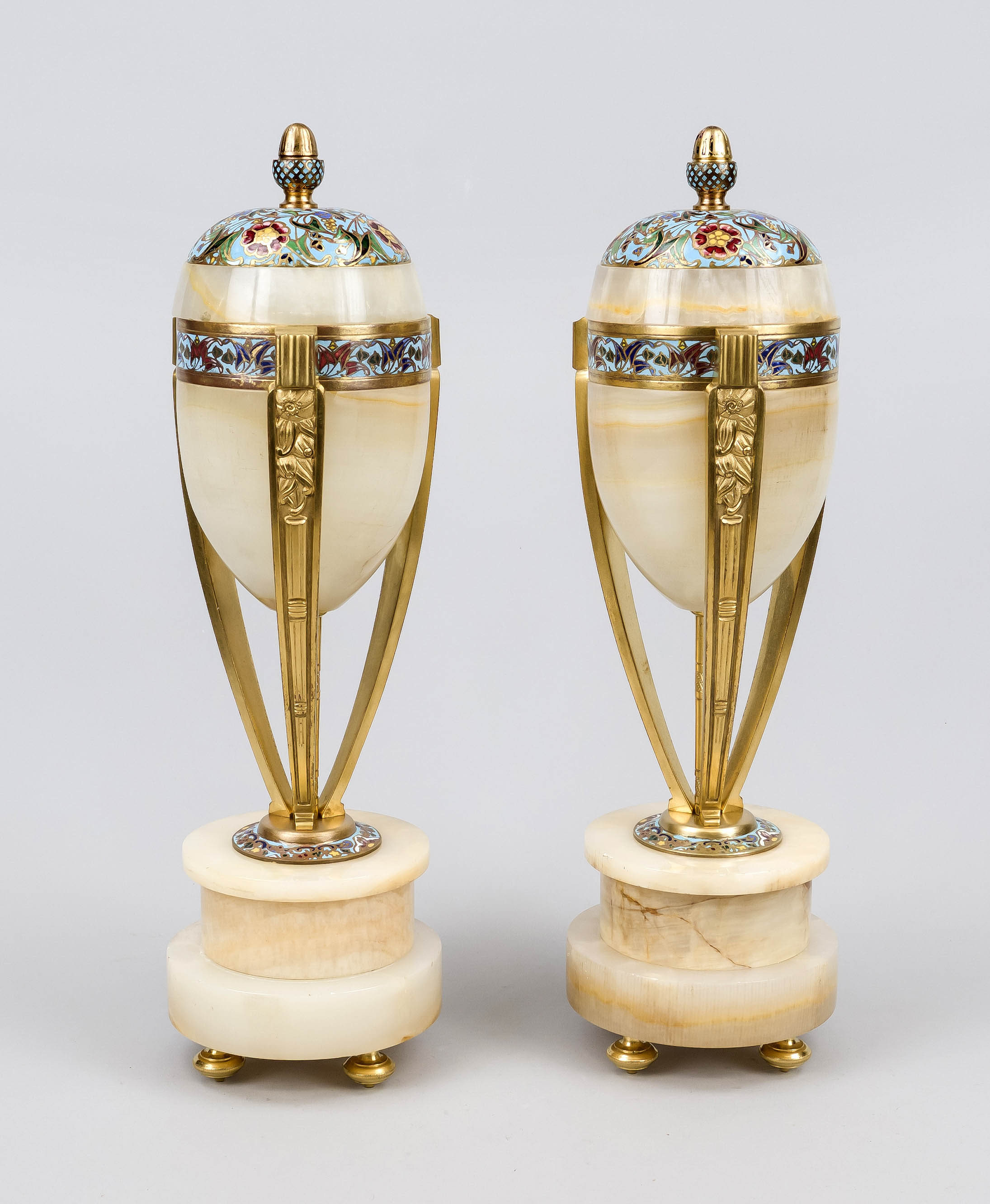 Pair of side plates, c. 1910, light onyx marble with gilt bronze, urn form with acorn finial on