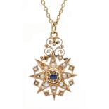 Star pendant GG 585/000 unmarked, tested, in the shape of a star with an oval faceted blue gemstone,