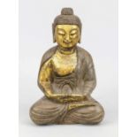 Large Buddha, Asia, 20th century, stone. Patinated in bronze look and decorated in gold, rubbed,