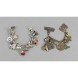 Two vintage costume jewelry charm bracelets, silver and bronze-coloured metal, various pendants, one