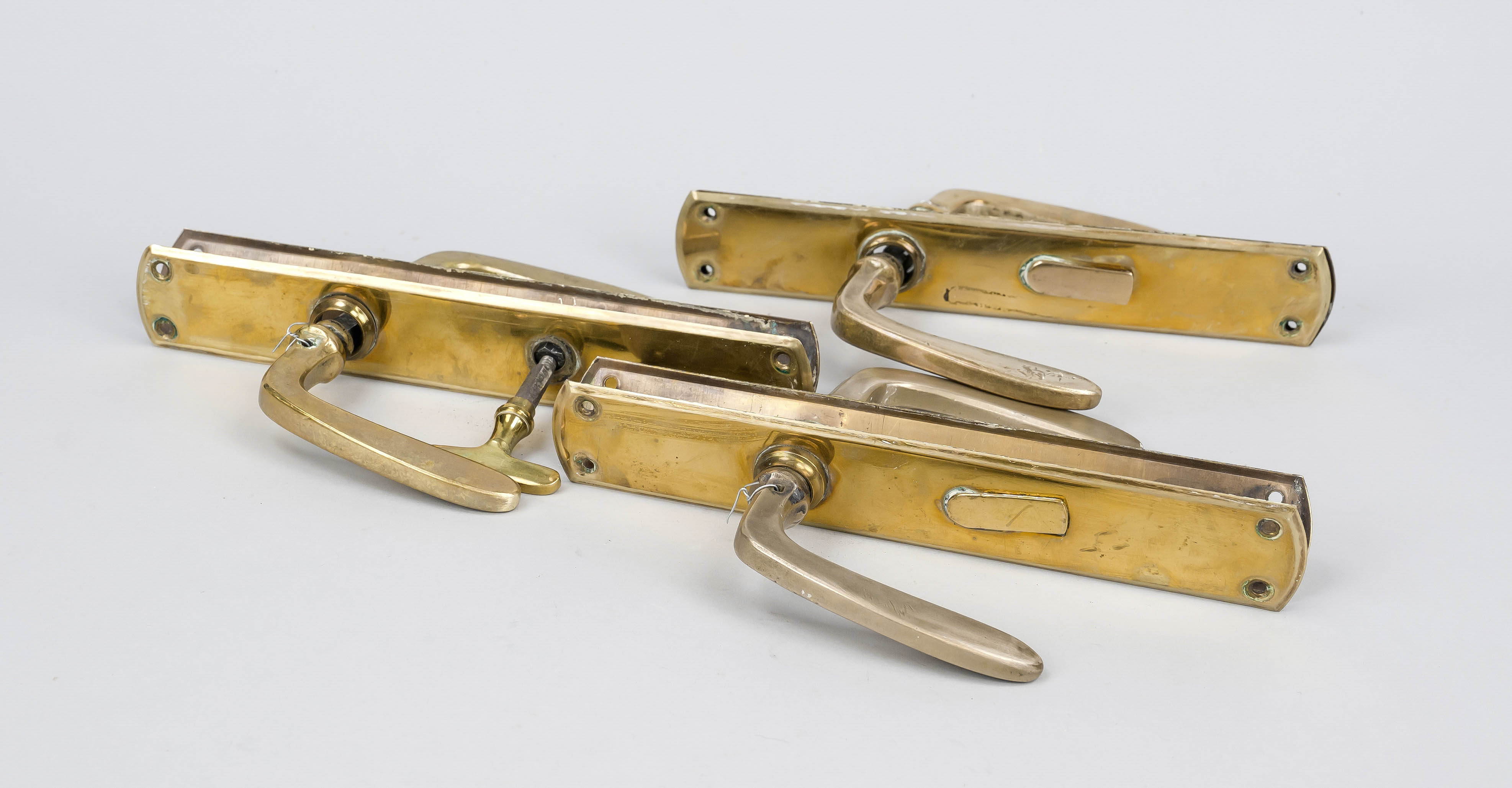3 door sets, 19th/20th century, brass. Oblobed panels, slightly profiled handles. Slightly rubbed,