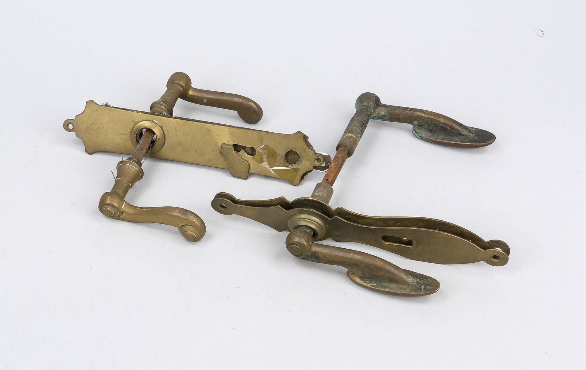 2 door handle sets from around 1900, brass, various shapes, l. approx. 24 cm