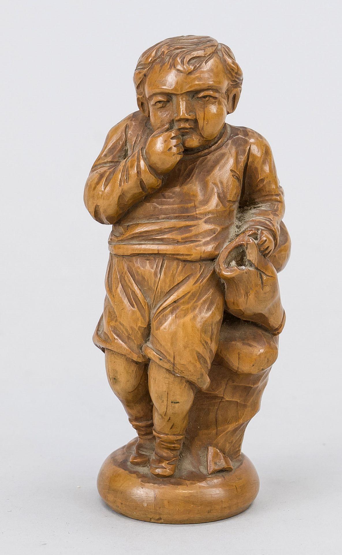 Boy with a broken jug, c. 1900, limewood. Small boy with a broken jug, his hand anxiously at his