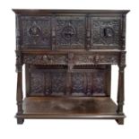 A stately historicism cabinet from around 1880, richly carved oak, three doors and two drawers