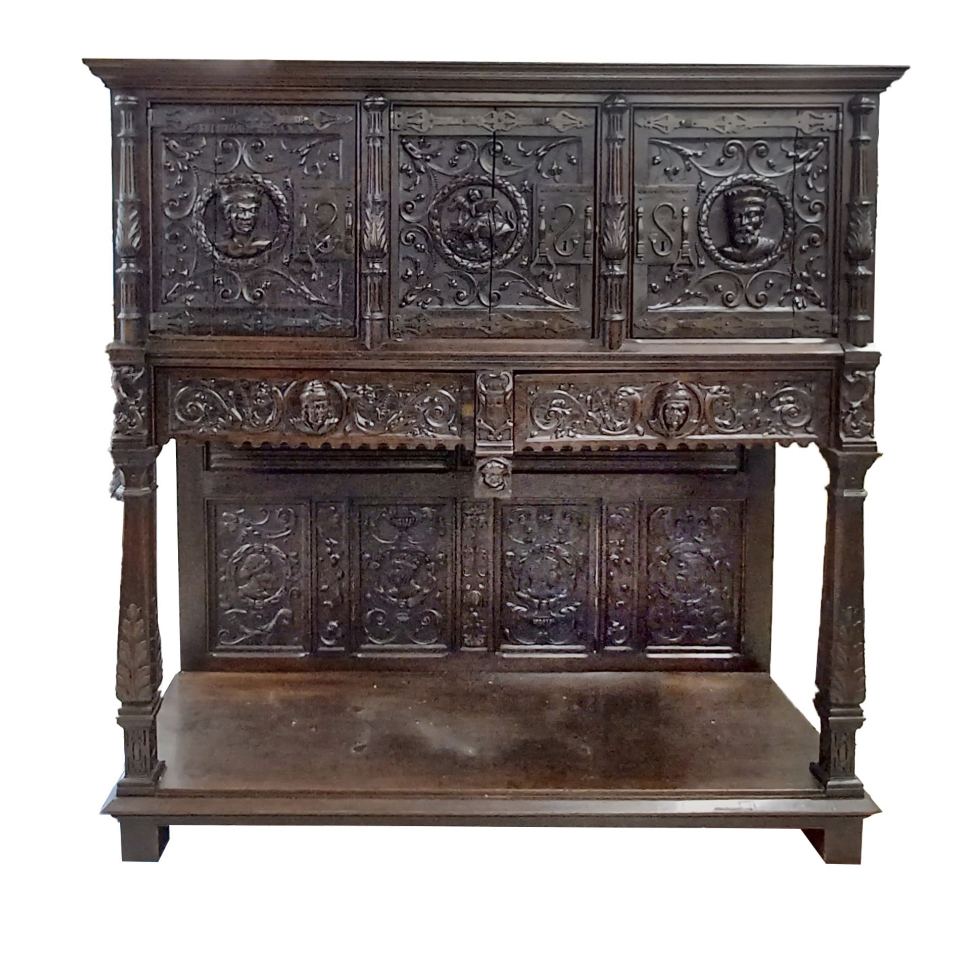 A stately historicism cabinet from around 1880, richly carved oak, three doors and two drawers