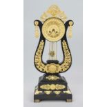 Lyre pendulum, 1st half 19th century, ebonized wood, gilded bronze applications, polished and