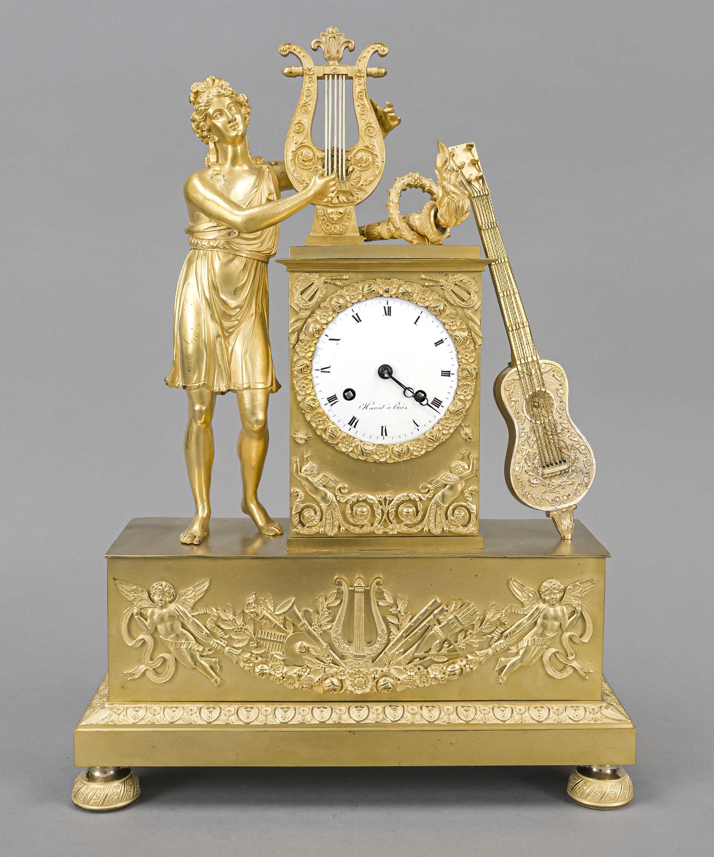 Empire bronze figure pendulum, 1st half 19th century, marked'' Horiot a`Paris'', young man playing