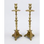 Pair of altar candlesticks, 18th/19th century, brass. Baluster shaft, triangular foot with stepped