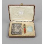 Two parts of an Art Nouveau smoking set, German, c. 1900, silver 800/000, cigarette case and holder,