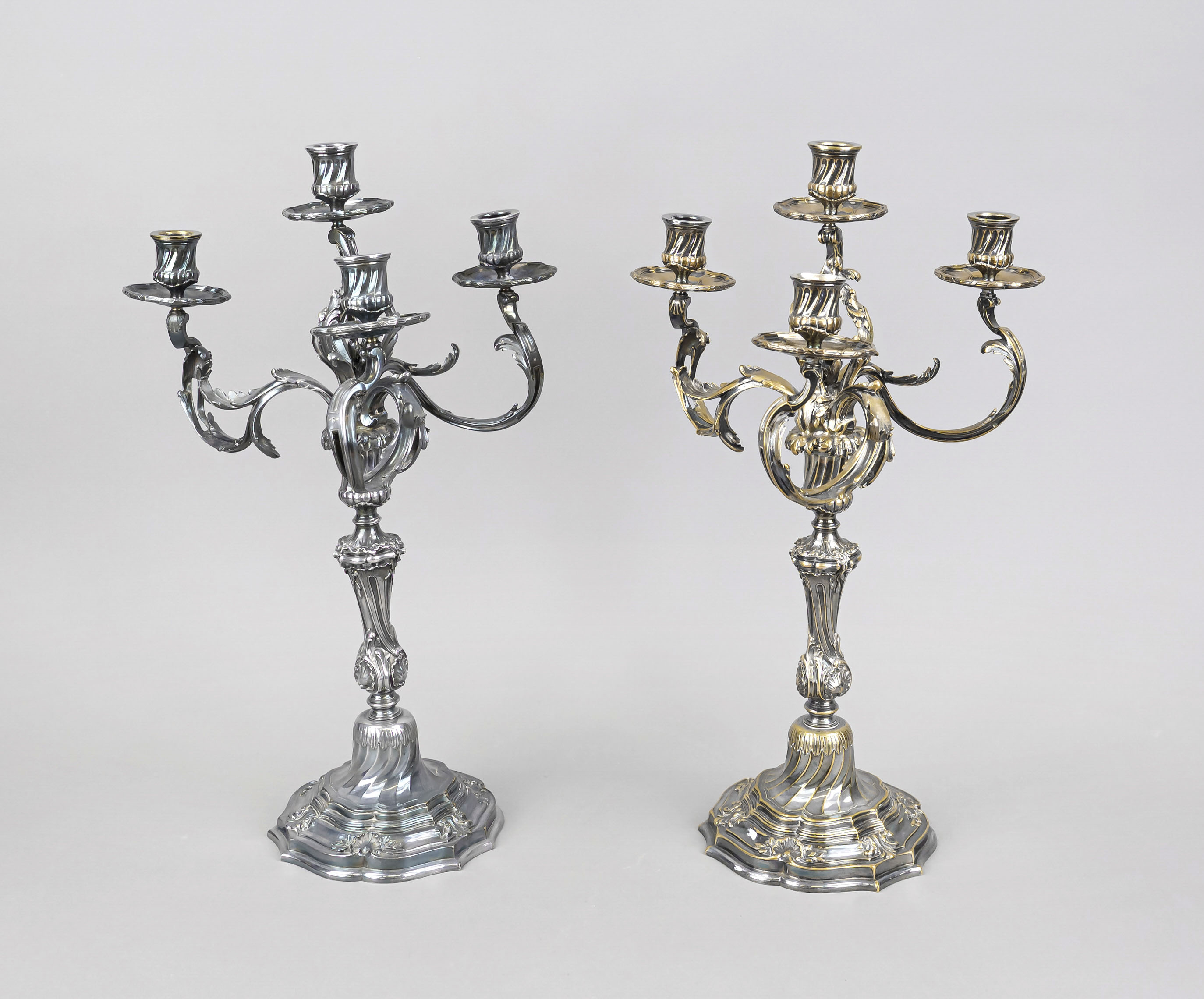 A pair of four-flame table candlesticks, 20th century, plated, round curved and domed stand,