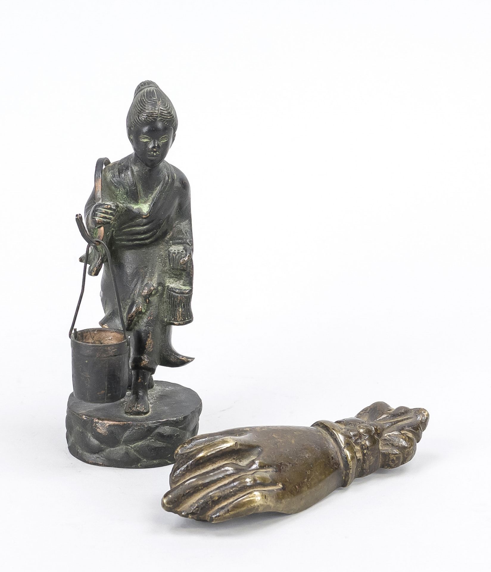 Peasant woman/water carrier, China, 19th/20th century, bronze. Striding on a terrain plinth, the
