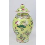 Lime green ground Famille Rose cover vase, China 19th century (Qing). Circumferential decoration