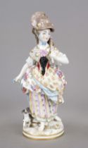 Wandering girl with hat, accompanied by her dog, 20th century, polychrome painted and ornamentally