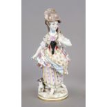 Wandering girl with hat, accompanied by her dog, 20th century, polychrome painted and ornamentally