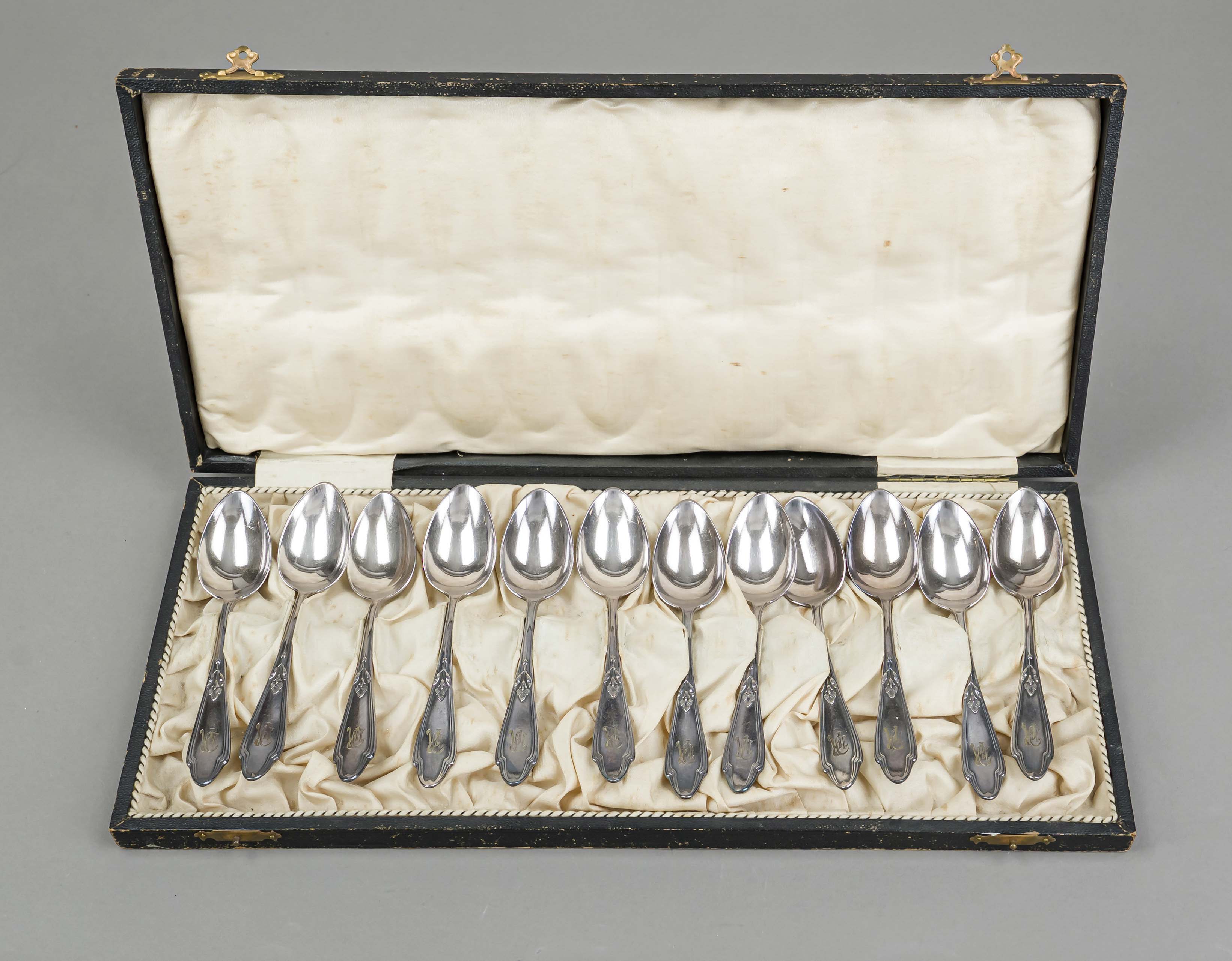 Twelve Art Nouveau teaspoons, circa 1900, marked MW, silver 12 solder (750/000), curved form, with