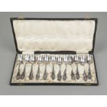 Twelve Art Nouveau teaspoons, circa 1900, marked MW, silver 12 solder (750/000), curved form, with