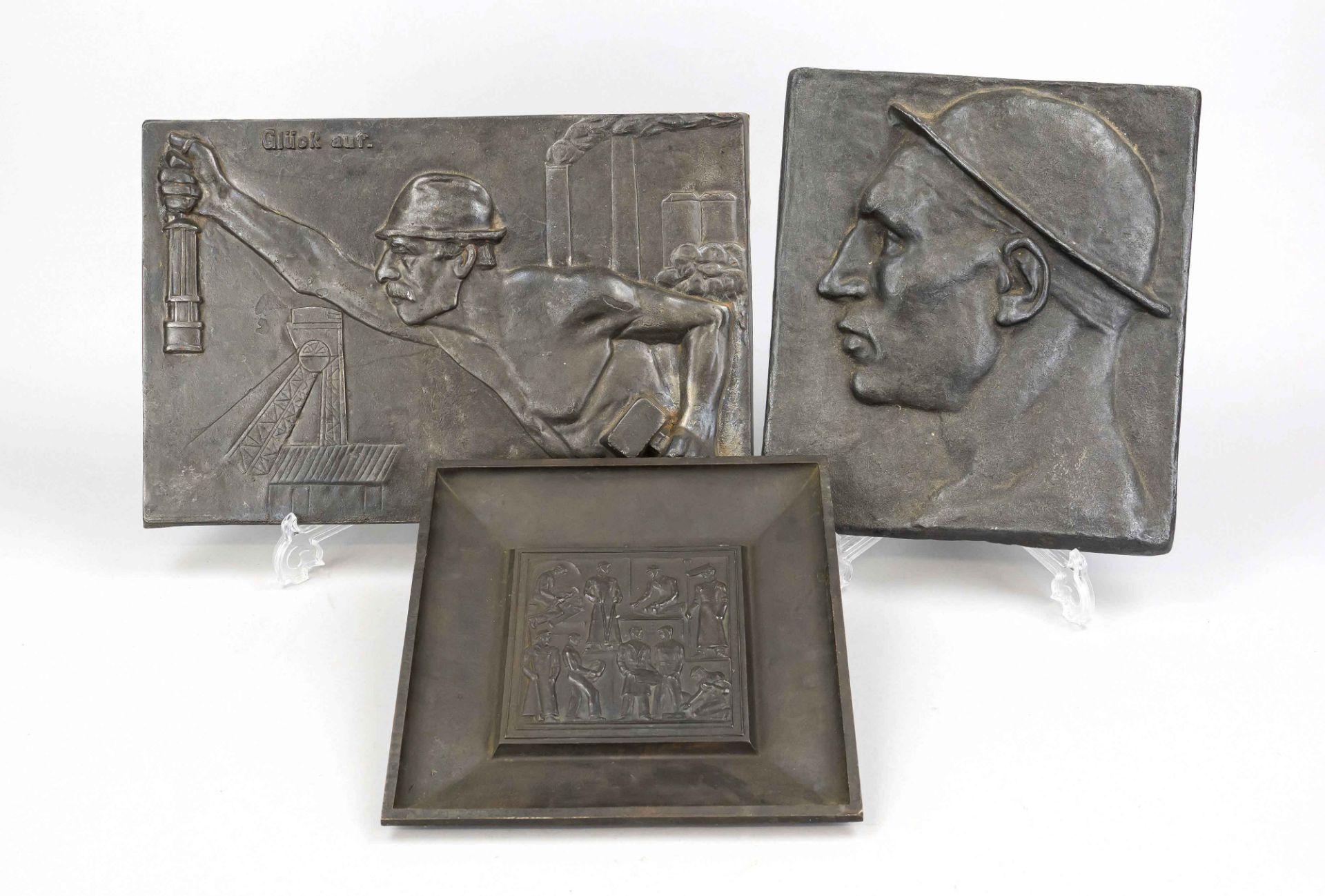 Three reliefs with mining motifs by various artists, 1st half of the 20th century: miner in profile,