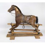 Rocking horse, late 19th century, with real fur (probably foal), leather saddle and bridle.