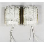 Pair of wall lamps, 1970s, fused clear glass, one socket each, h.22, w. 18 cm