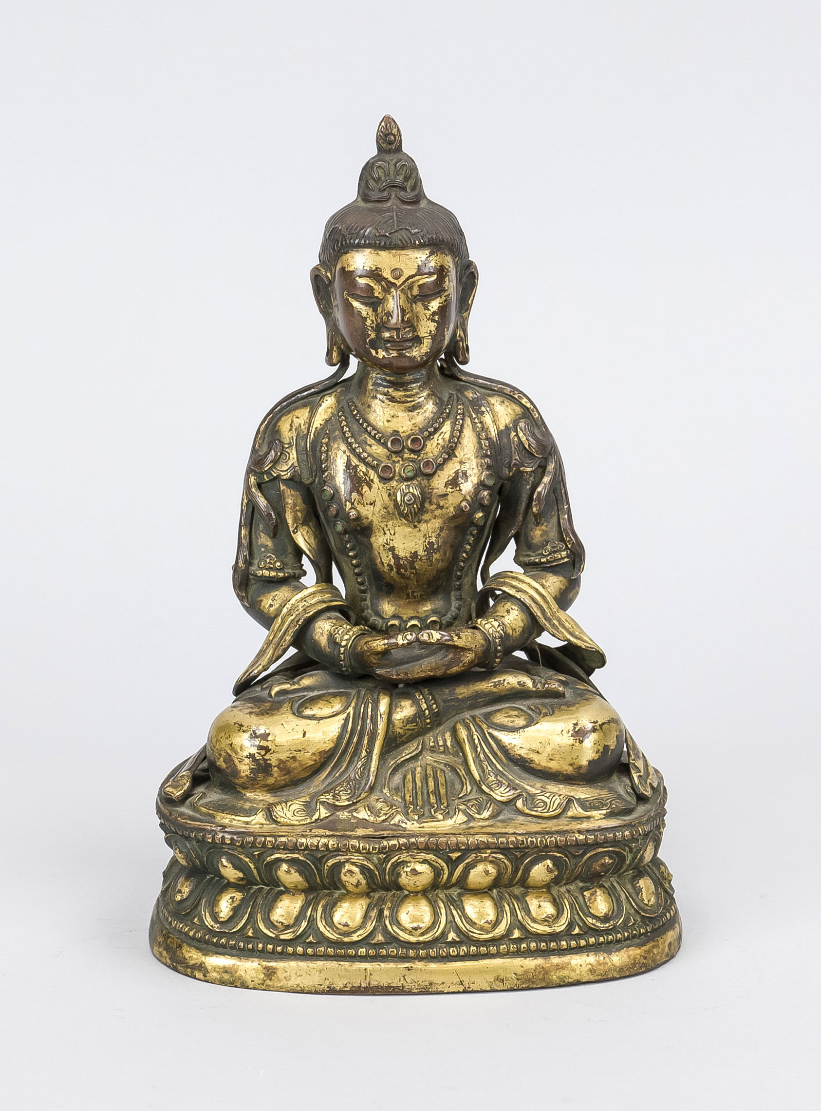 Buddha, Tibet, probably 19th century, hollow copper figure with residual gilding, ornamental