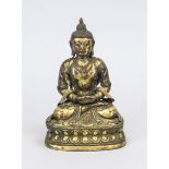 Buddha, Tibet, probably 19th century, hollow copper figure with residual gilding, ornamental