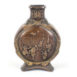 Moon flask vase with relief decoration, Japan late 19th century (Meiji), bronze. Amusing relief