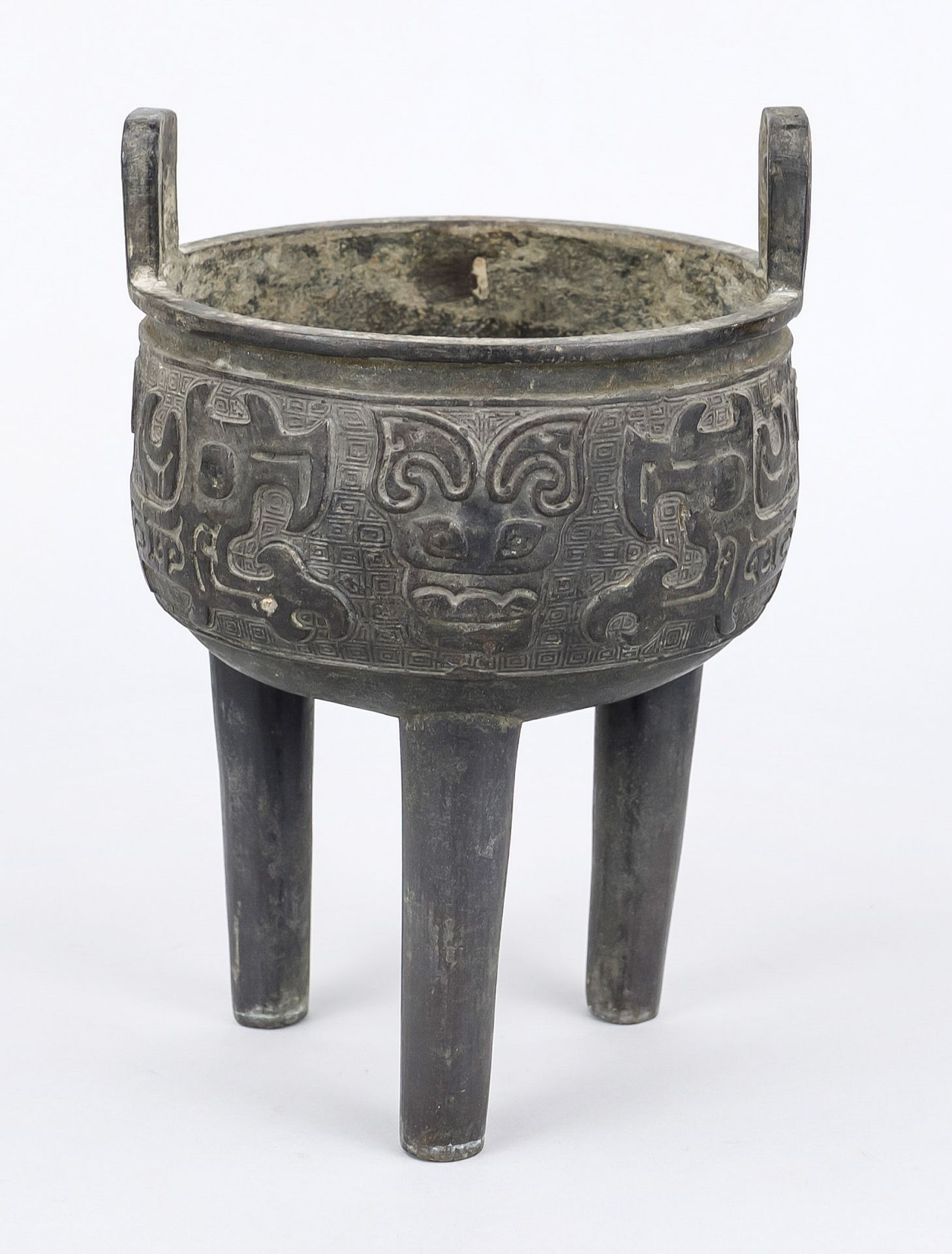 Tripod censer in archaic style, China, bronze. Round vessel with surrounding taotie relief