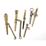 6 antique pocket watch keys, 19th century, slim shape once with ratchet, silver and gold plated,