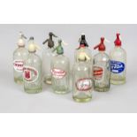 8 soda bottles, glass with soda top, glass, some with brand labels, rubbed, h. 31 cm
